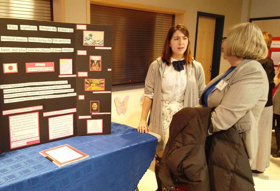 Photo of student making a presentation at Senior Project Night.